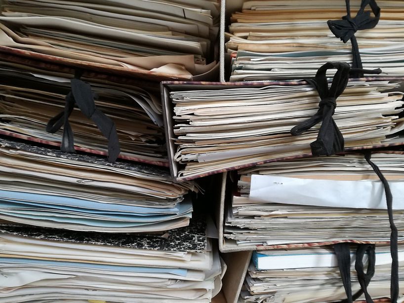 Lots and lots and lots of paperwork all stacked up! Katie Stone, Education Business Services